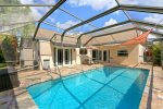 Fully enclosed backyard keeps the pool clean and cool. A big plus during hot Florida Days